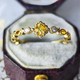 【神様の宿る石】天然イエローサファイア プクラジ ハーフエタニティリング